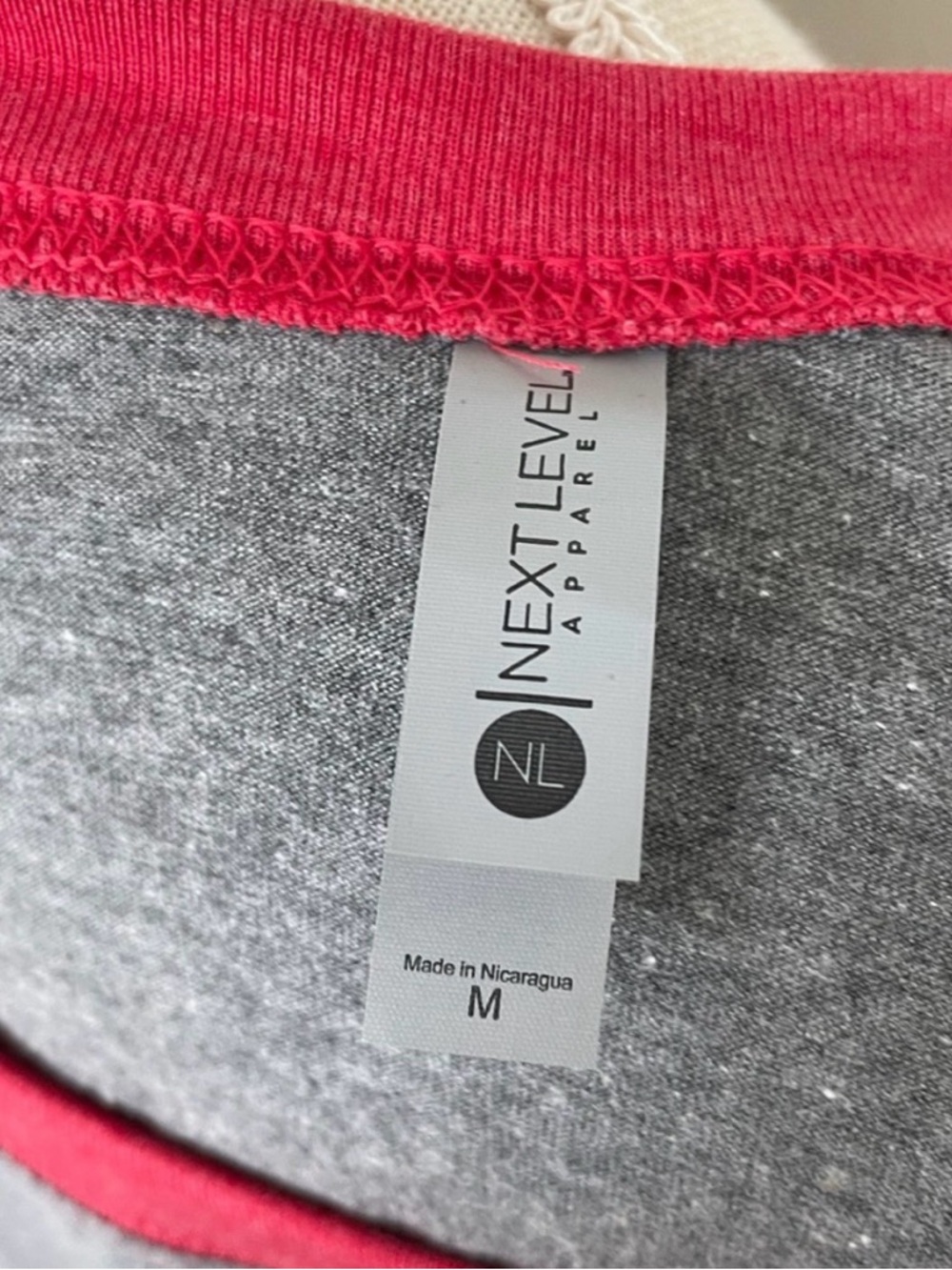 Next Level Apparel Grey Tee with red Crewneck & Raglan Sleeve Trim.